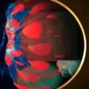 The artwork Welcome to my eyeball features a circular frame; the left shows vibrant red petals on a swirling blue background, contrasting with the right sides minimal room with a bed.