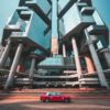 A Lippo red taxi glides along the street before the Lippo Centre—a modern complex featuring geometric glass towers and large cylindrical supports—resembles an urban art print against a clear blue sky.