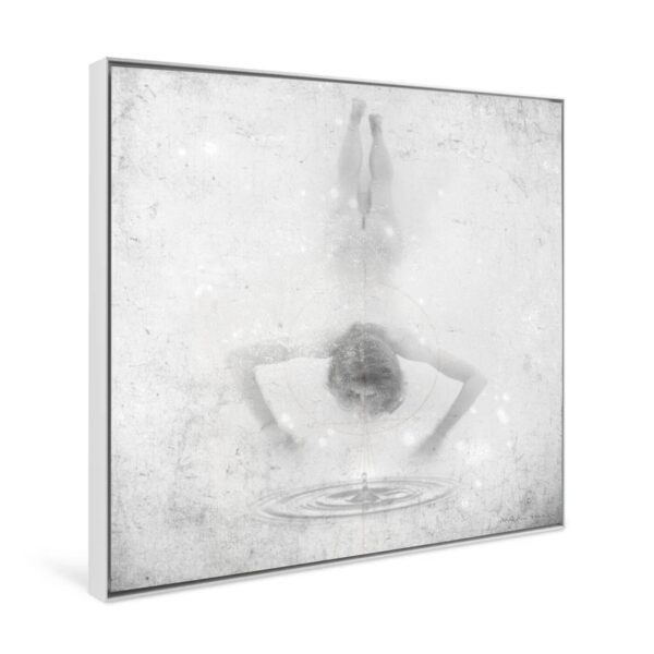 The black and white art print titled Ingrávido 008 depicts a person bending over a pool of water, their reflection creating ripples. Its textured, faded background enhances the dreamlike atmosphere. This captivating piece is elegantly framed on a square canvas.