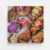 The art print Colourfully Delicious features vibrant croissants decorated with berries, nuts, rings, and pearls. Its a detailed painting with a luxurious and whimsical theme that captivates the eye.