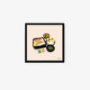 This art print, titled Salt-grilled Salmon Bento, displays a Japanese meal with a bento box featuring rice and unagi, accompanied by miso soup, pickles, and sushi. Framed in black against a light background, it captures the essence of traditional Japanese cuisine.