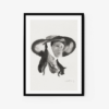 The Determined artwork is a black-and-white watercolor print of a person in a wide-brimmed hat with a neutral expression, signed at the bottom. Its elegantly framed in black against a crisp white background.