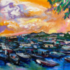 Art print titled 日落。長洲 Cheung Chau: Sunset featuring a vibrant harbor at sunset. An array of boats is reflected in swirls of orange, purple, and yellow waters. Buildings and trees line the horizon, with leafy branches framing the top right corner.