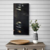 A stylish modern interior features the Passerby No.4 art print on a striped wall. Below, a wooden platter sits on the sleek grey cabinet, accompanied by a ceramic vase filled with green eucalyptus branches.